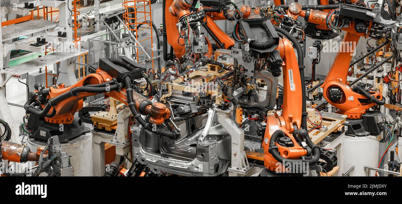 Photo of automobile production line. Modern car assembly plant. Modern and high-tech automotive industry Stock Photo