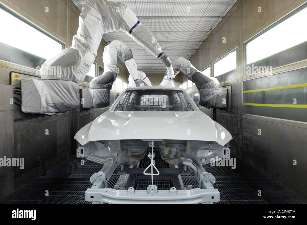 Car bodies are on assembly line. Modern automotive industry. A car being painted in a high-tech enterprise Stock Photo