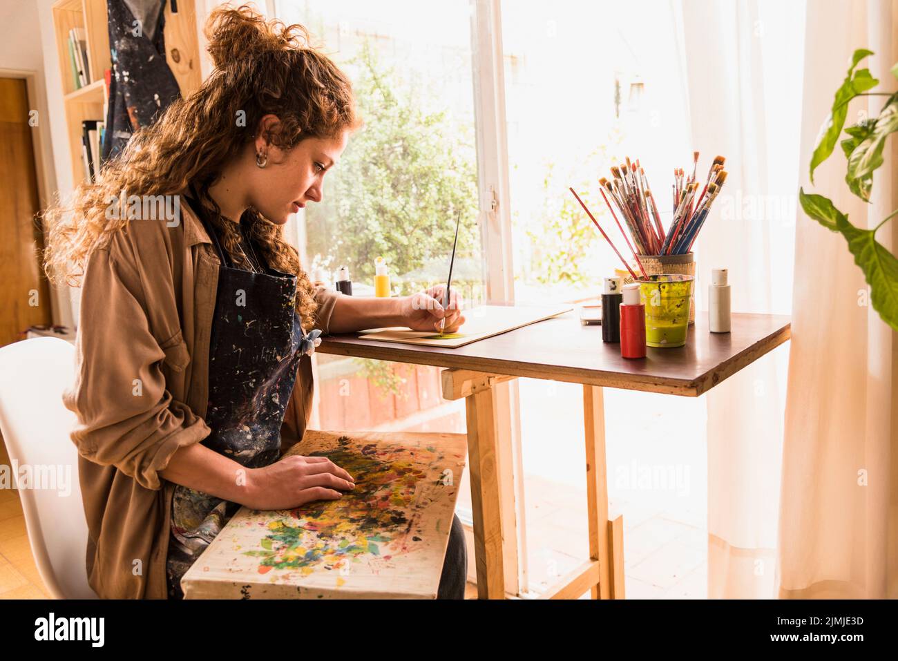 Girl painting canvas Stock Photo Alamy