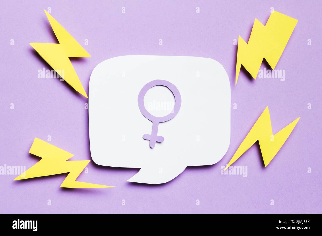 Feminine gender sign speech bubble surrounded by thunders Stock Photo