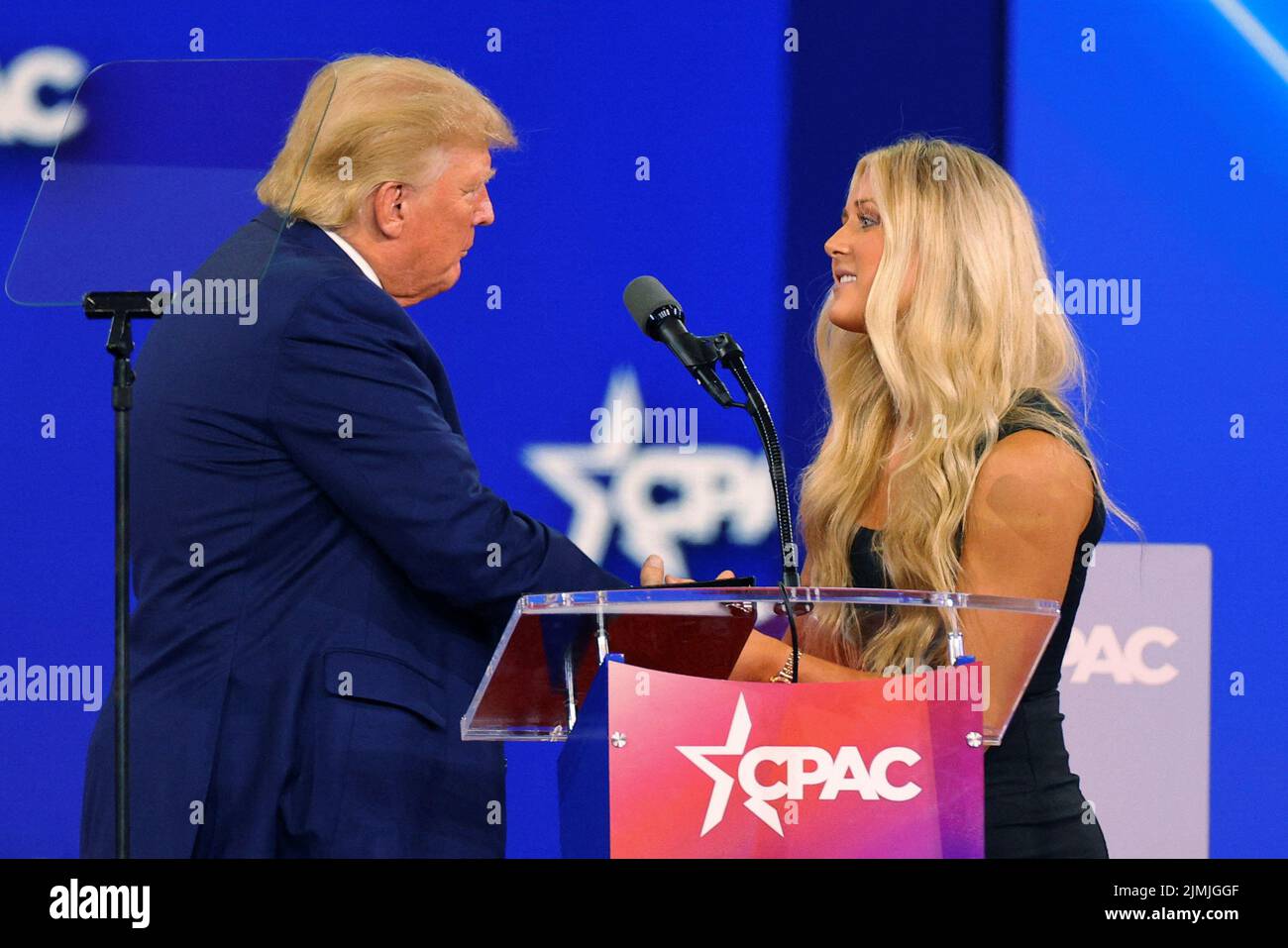 Former U.S. President Donald Trump is joined onstage by SEC champion swimmer Riley Gaines at the Conservative Political Action Conference (CPAC) in Dallas, Texas, U.S., August 6, 2022.  REUTERS/Brian Snyder Stock Photo