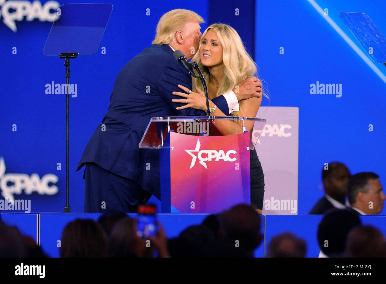Former U.S. President Donald Trump is joined onstage by SEC champion swimmer Riley Gaines at the Conservative Political Action Conference (CPAC) in Dallas, Texas, U.S., August 6, 2022.  REUTERS/Brian Snyder Stock Photo