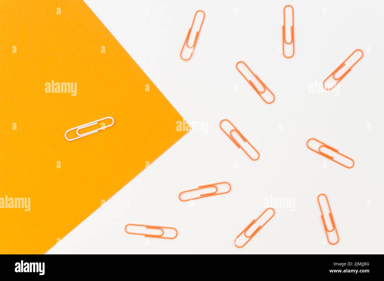 Collection paper clips with only white one Stock Photo