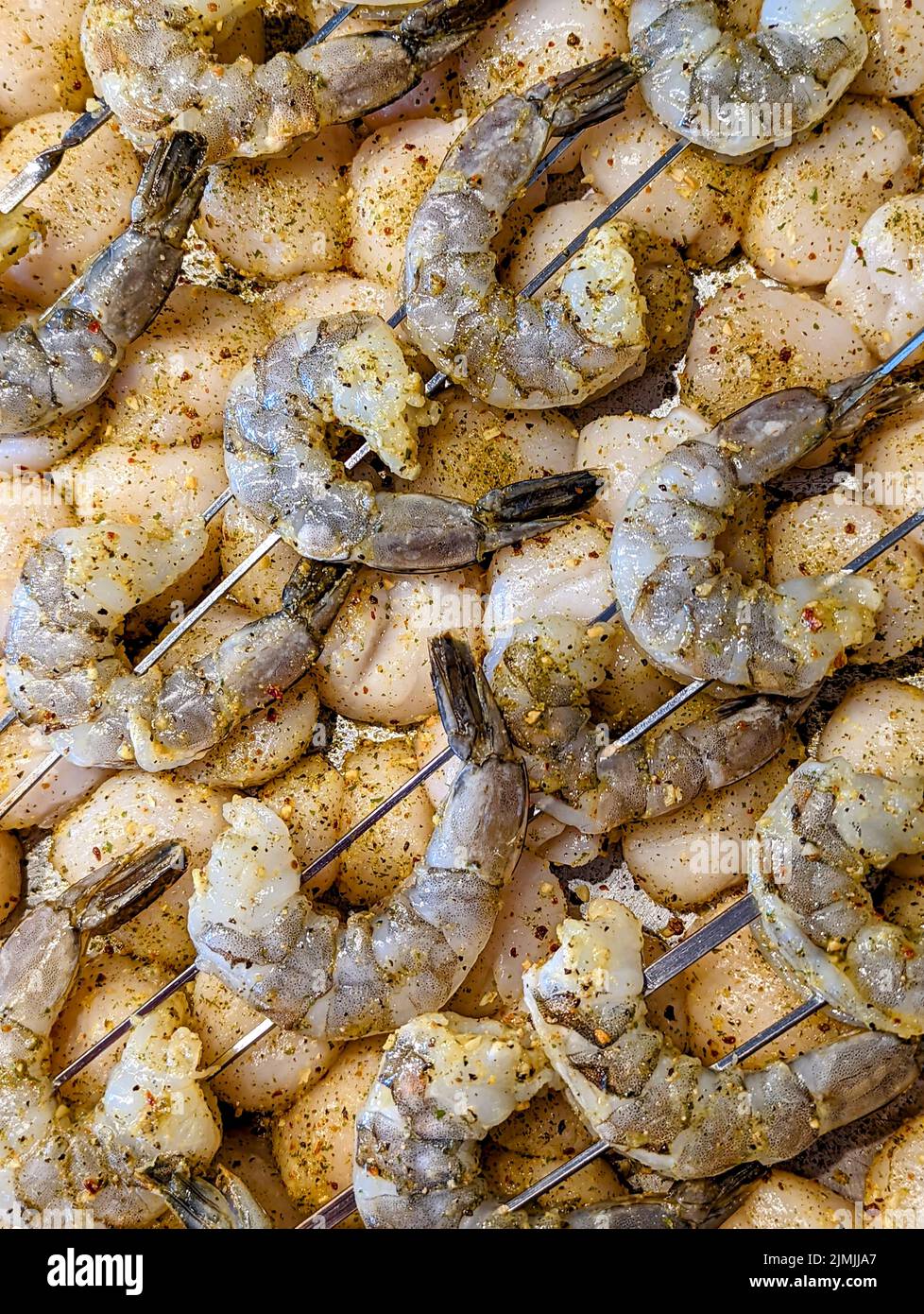 Raw seasoned shrimp and scallops ready to grill Stock Photo Alamy