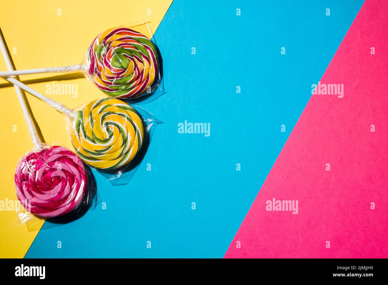 Colorful lollipops candies striped colorful background Stock Photo