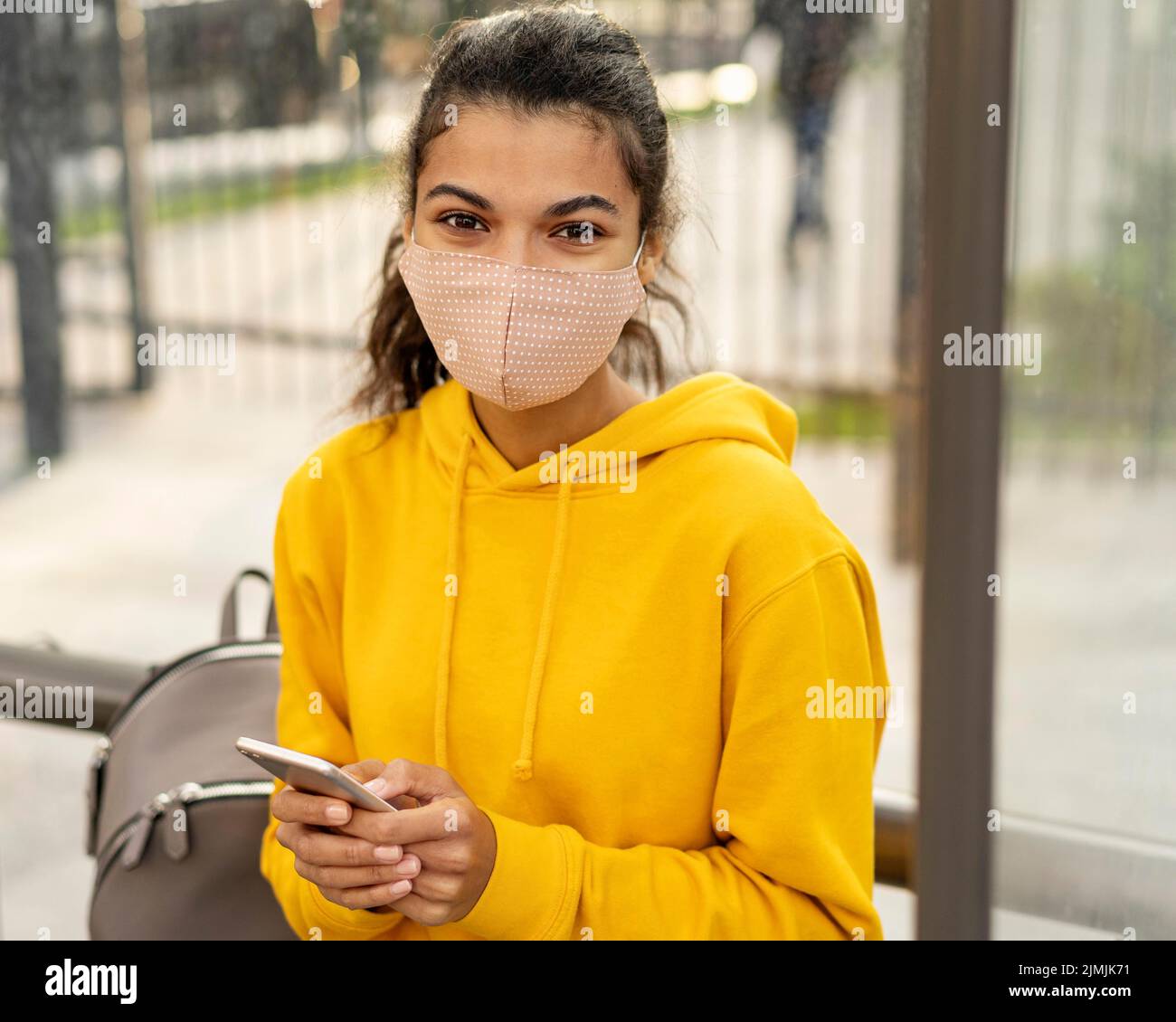Front view girl with face mask street Stock Photo