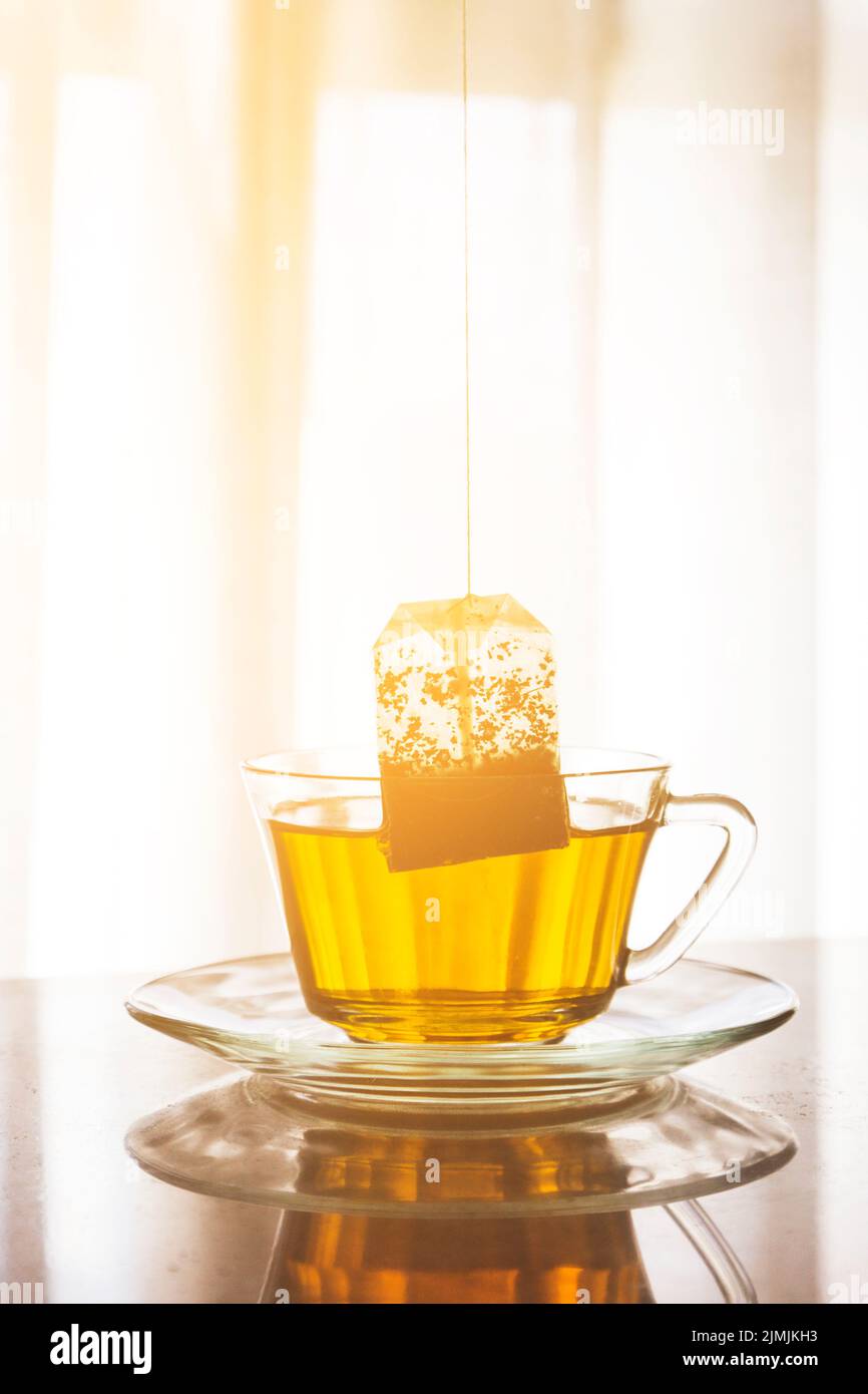Tea bag inside cup Stock Photo