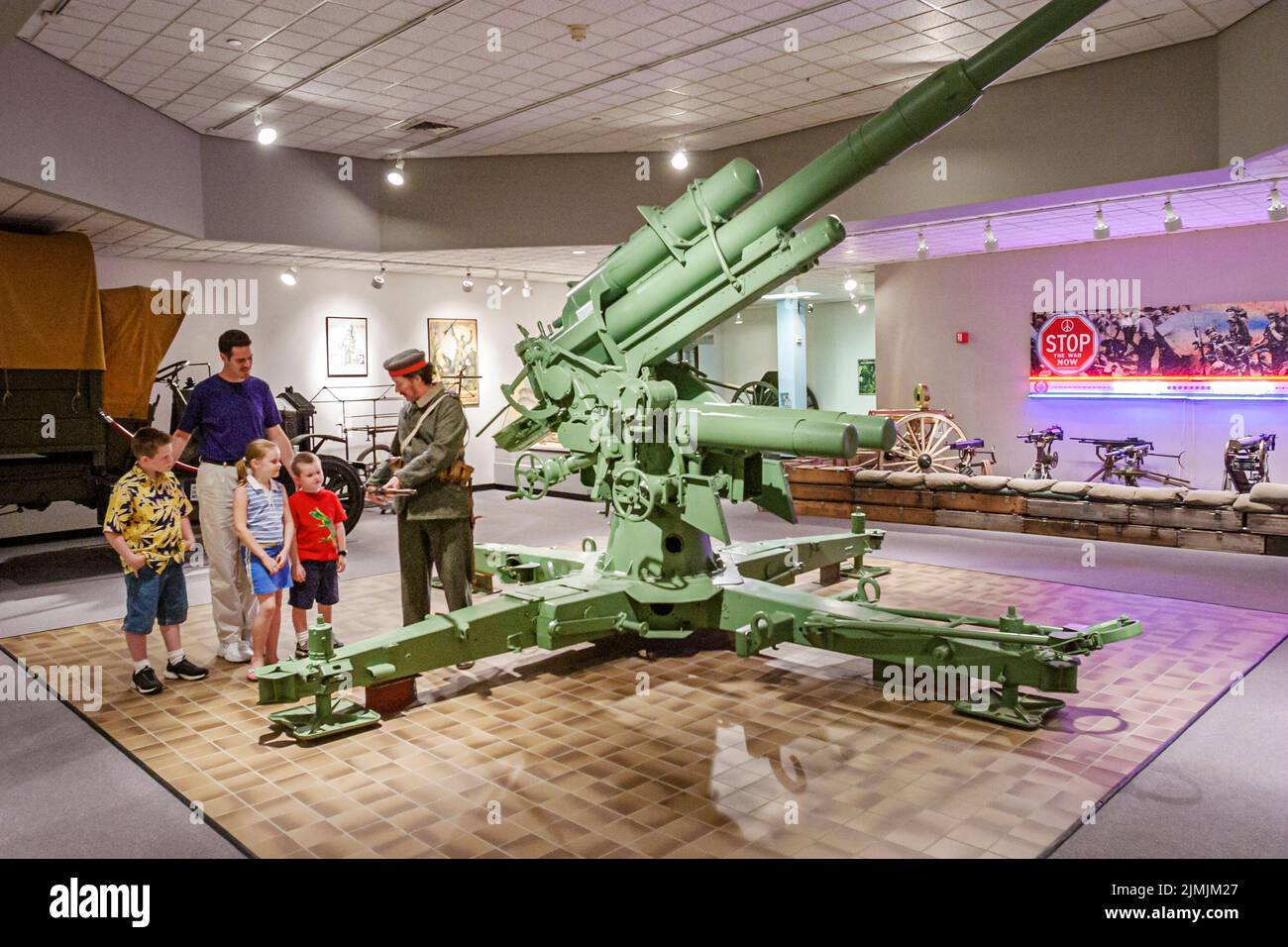Newport News Virginia,Virginia War Museum,history exhibit collection display weapon artillery gun family looking boy girl father guide explaining Stock Photo