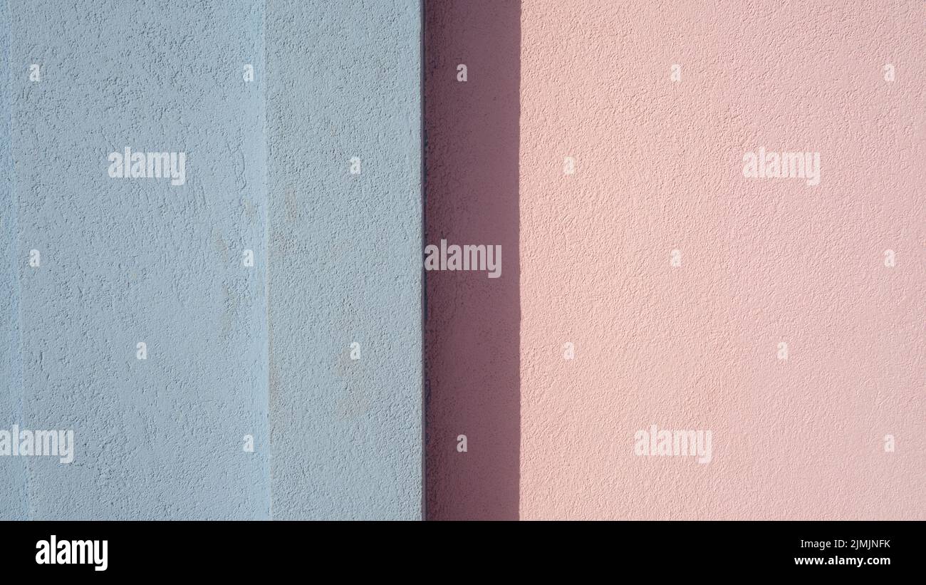 A pink and blue painted wall Stock Photo
