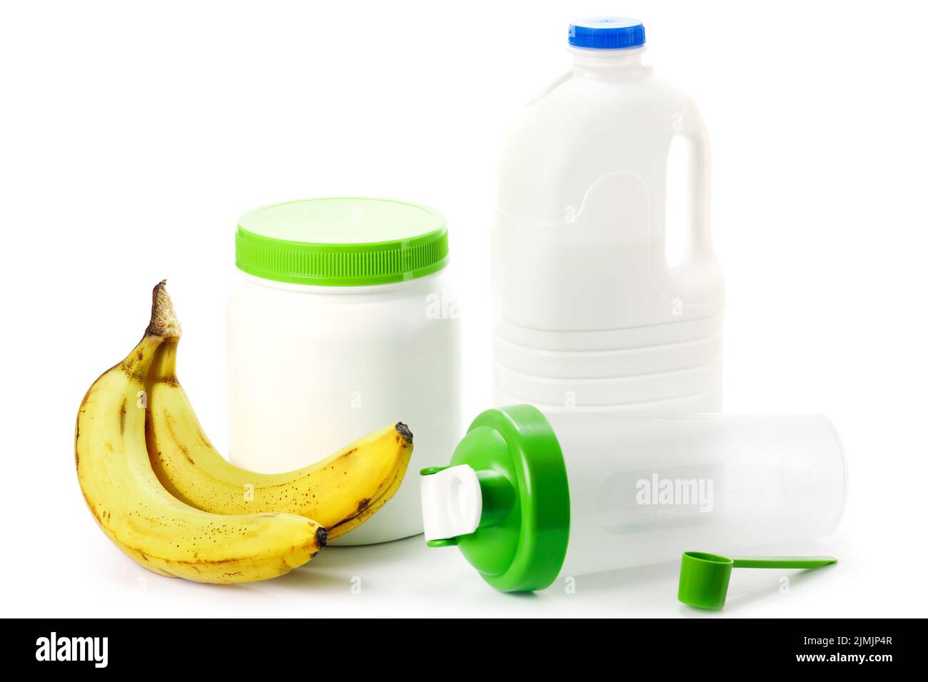 Protein shaker, big bottle of milk and bananas Stock Photo Alamy