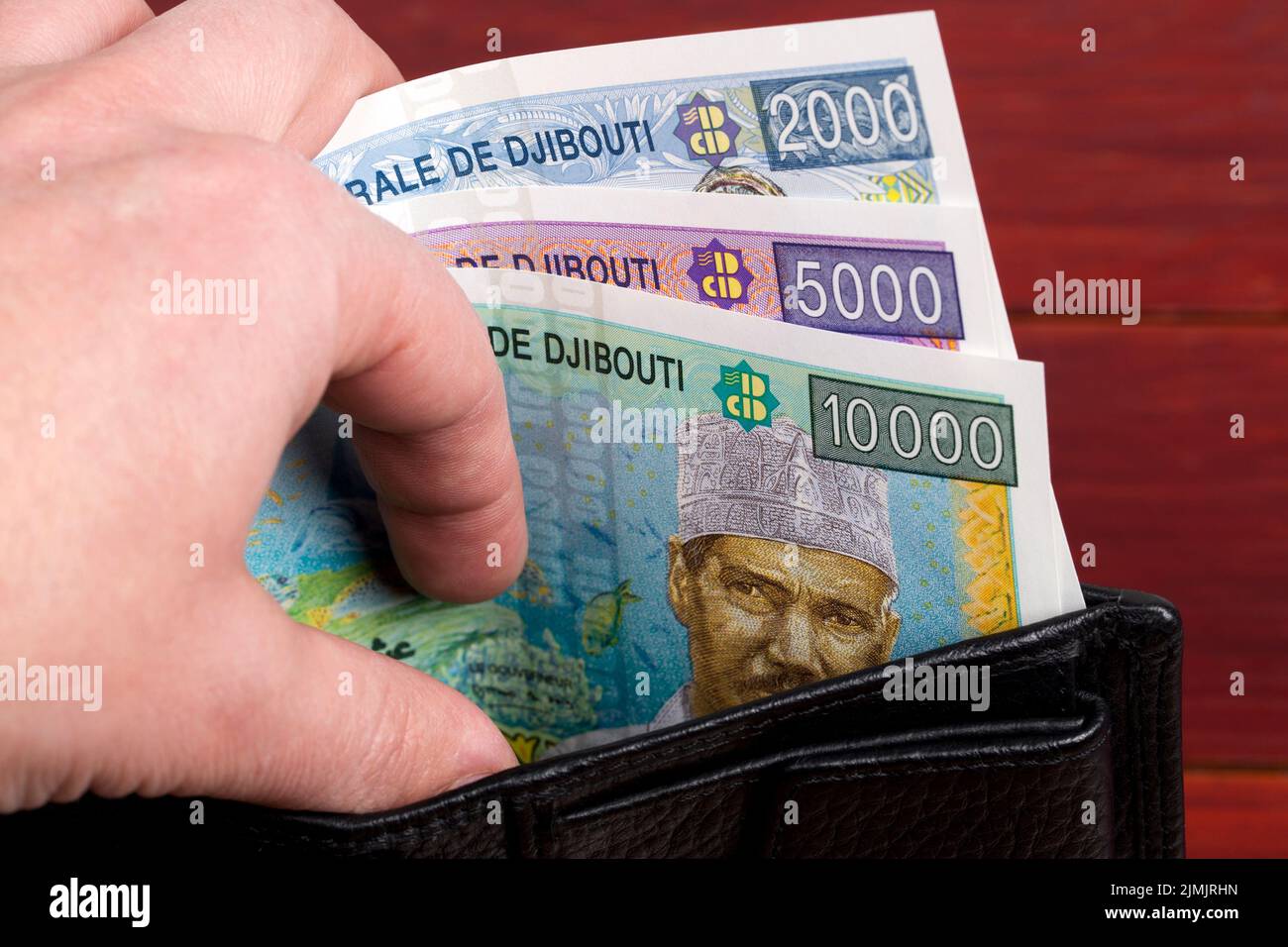 Djiboutian franc in the black wallet Stock Photo