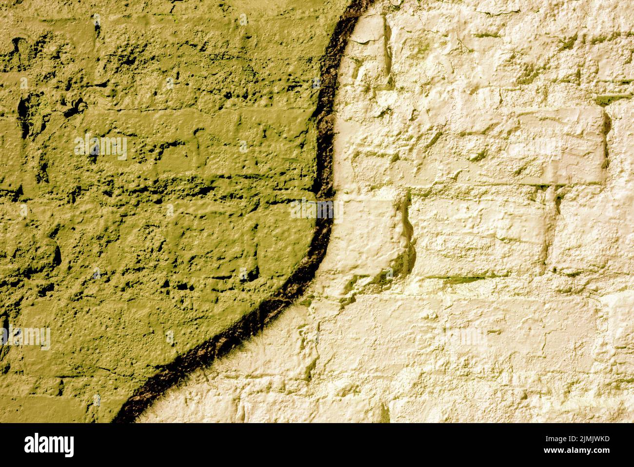 Brick wall painted yellow. Background texture. Stock Photo