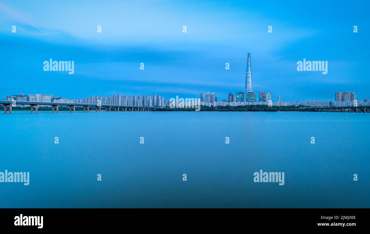 Blue hour view of Lotte World Tower skyscraper and Han River in Seoul South Korea on 5 August 2022 Stock Photo
