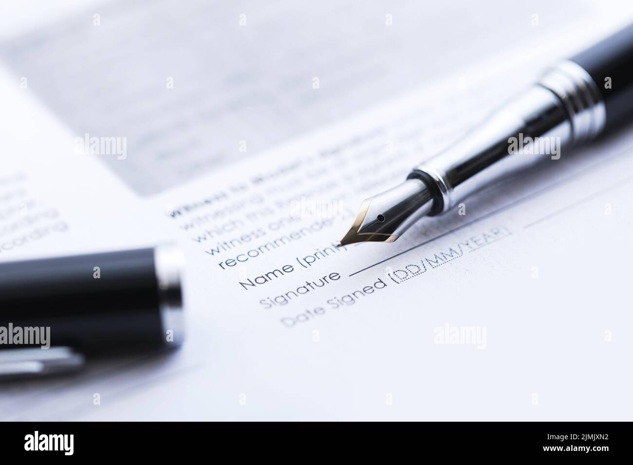 Signing the business contract. Fountain pen and document. Stock Photo