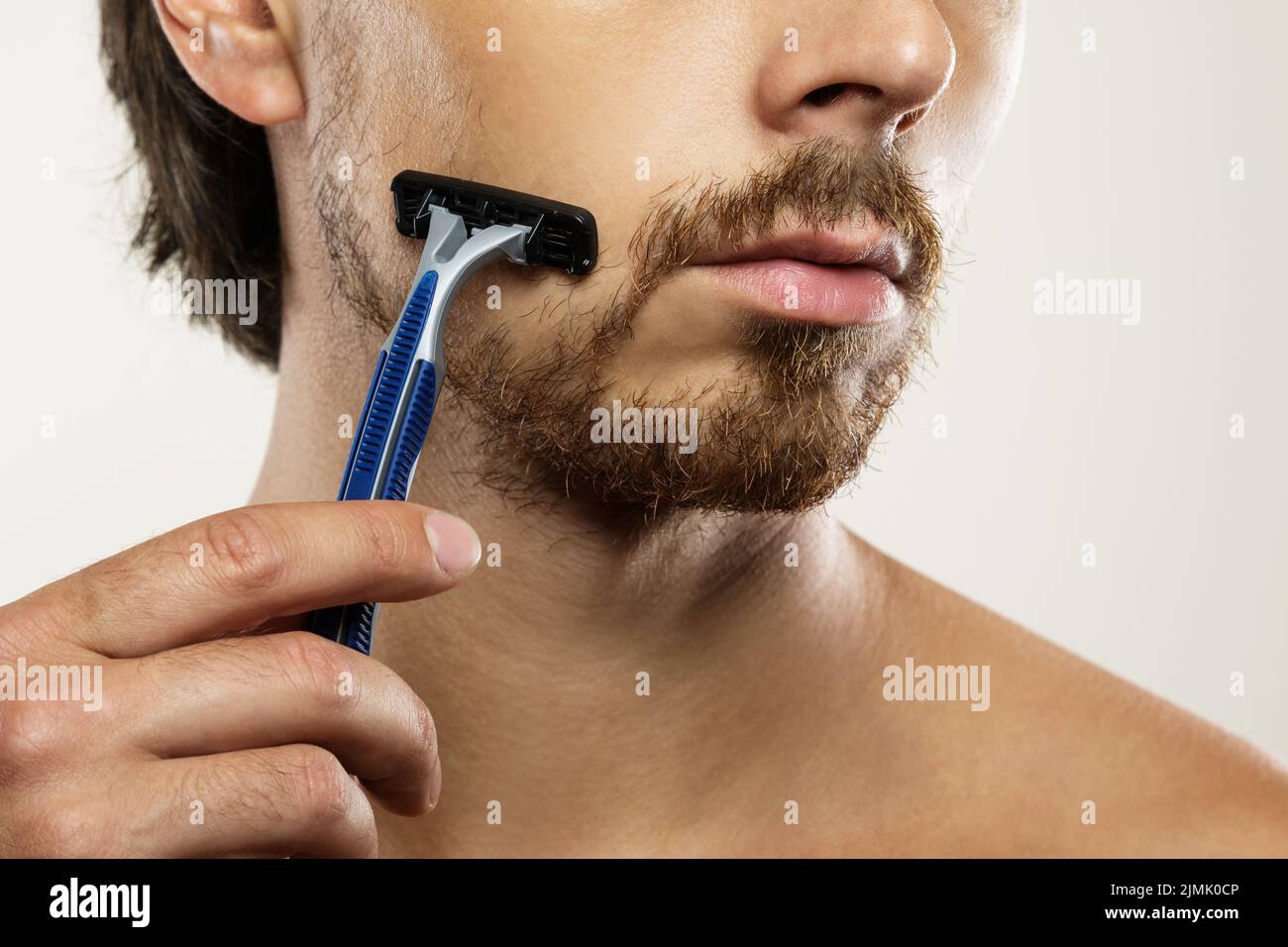 Man with unkempt beard before a shaving routine Stock Photo