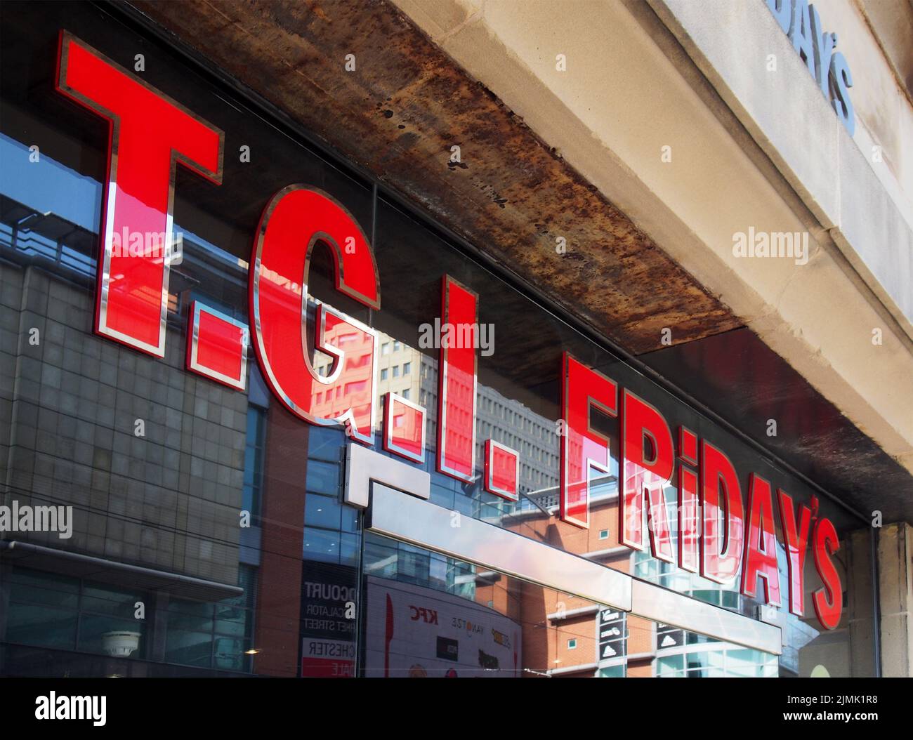 Sign on the window of a tgi fridays restaurant in manchester city centre Stock Photo