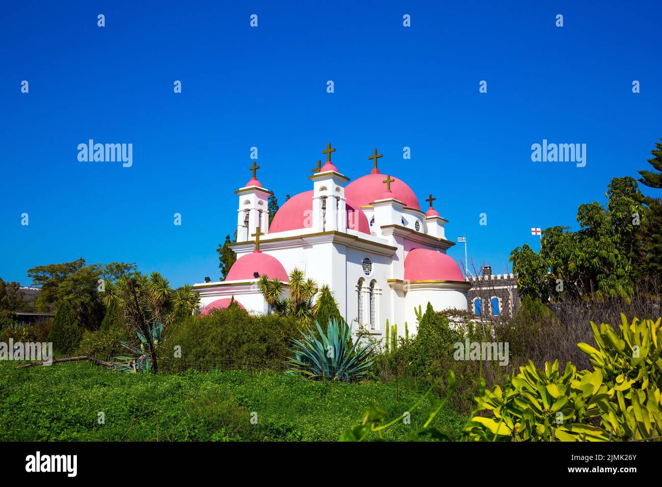 Church with pink domes and golden crosses Stock Photo