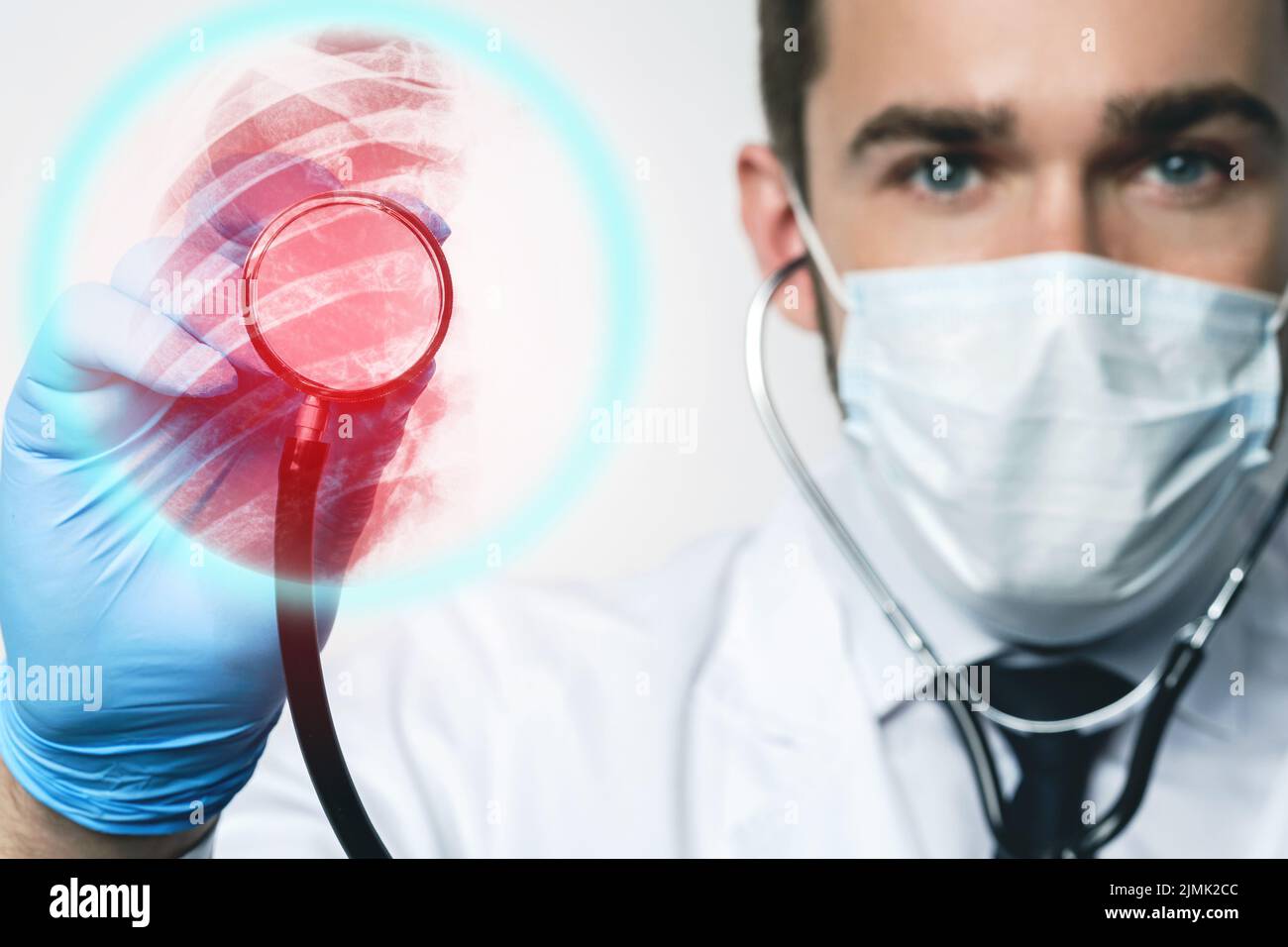 Pulmonologist with stethoscope inspecting lungs with Xray Stock Photo