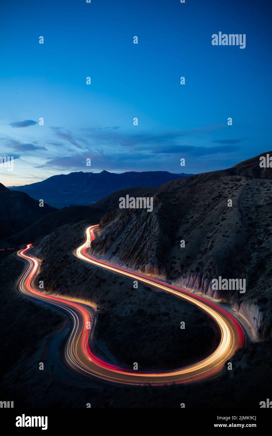 Cars travel through a sleepy canyon tucked away in the California mountains outside LA. Stock Photo
