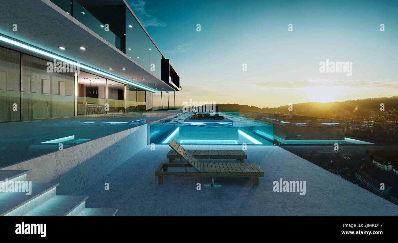Luxury villa exterior design with beautiful sunset at the infinity pool Stock Photo