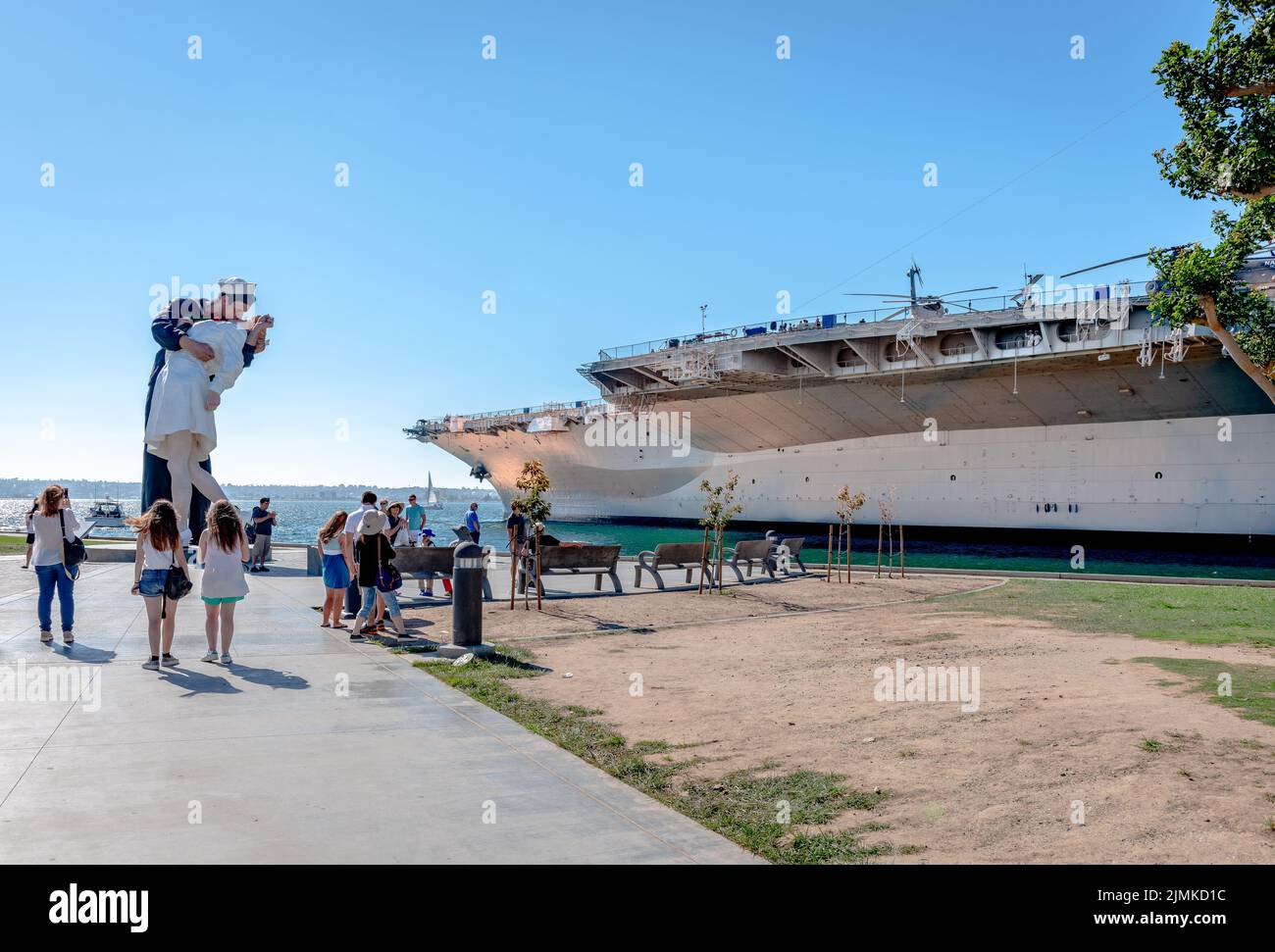 San Diego, Ca, USA - July 25 2015: View of the Tuna Harbor Park, with  The Kissing Taylor aka Unconditionally Surrender statue and the UUS Midway Muse Stock Photo
