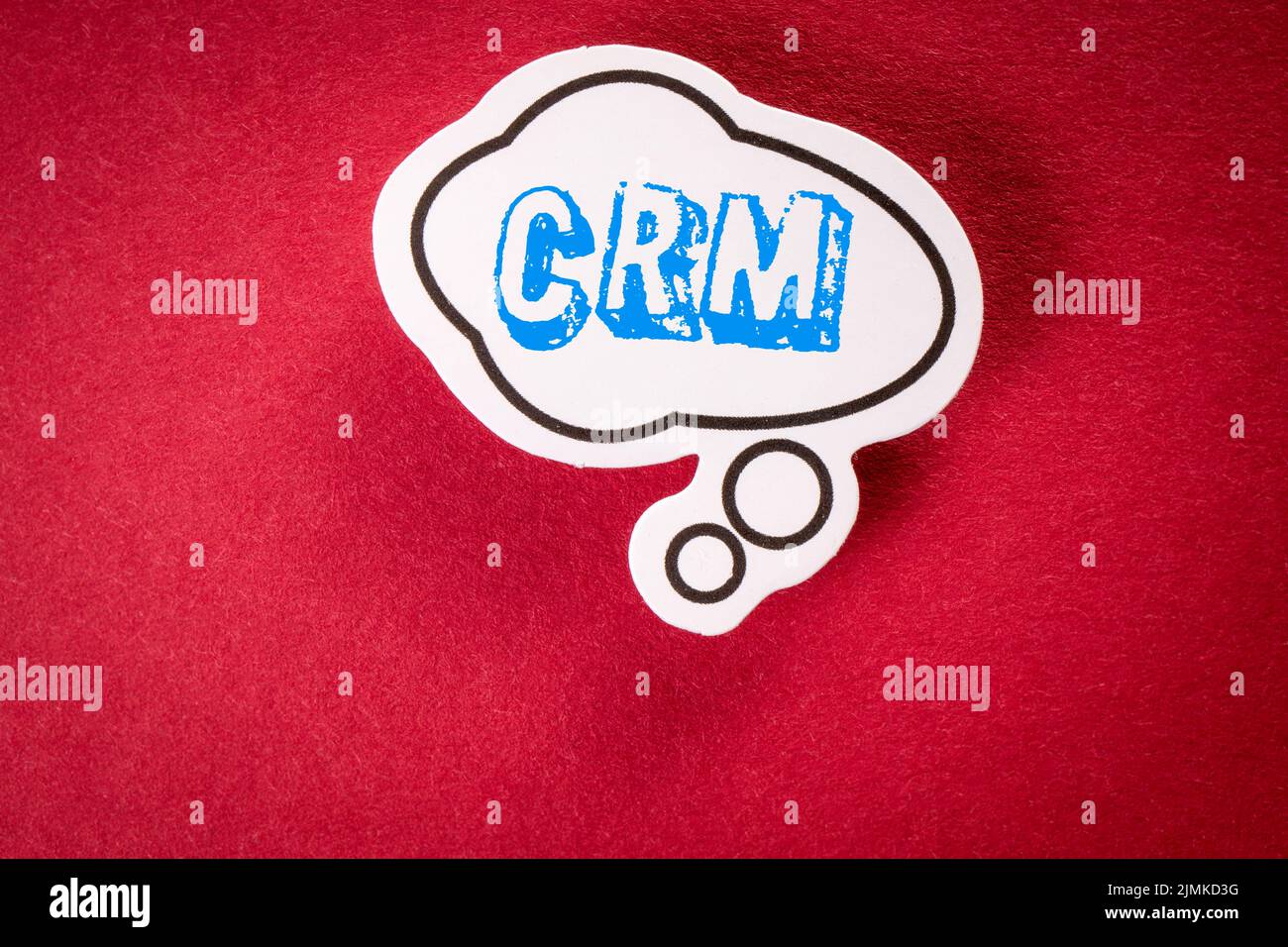 CRM Customer relationship management concept. Speech bubble on red background. Stock Photo