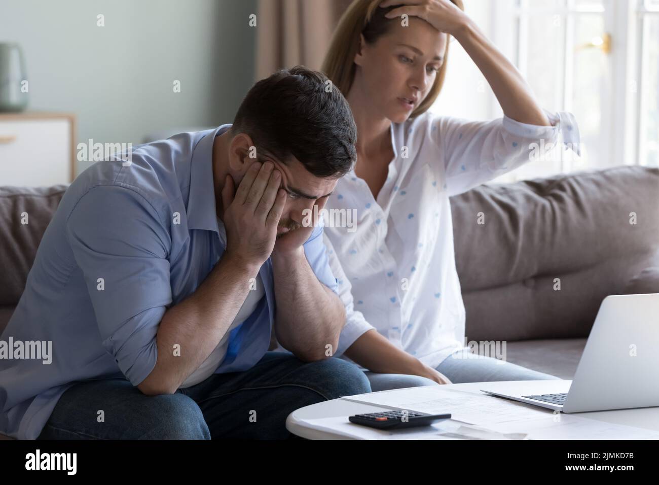 Spouses manage finances, analyze expenses, check budget looks disappointed Stock Photo