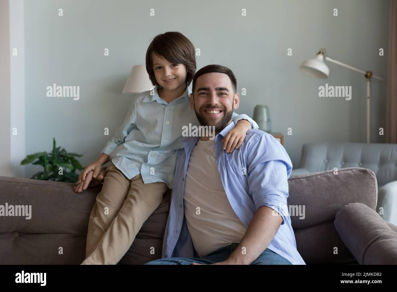 Young father and preschooler son smile pose for camera Stock Photo