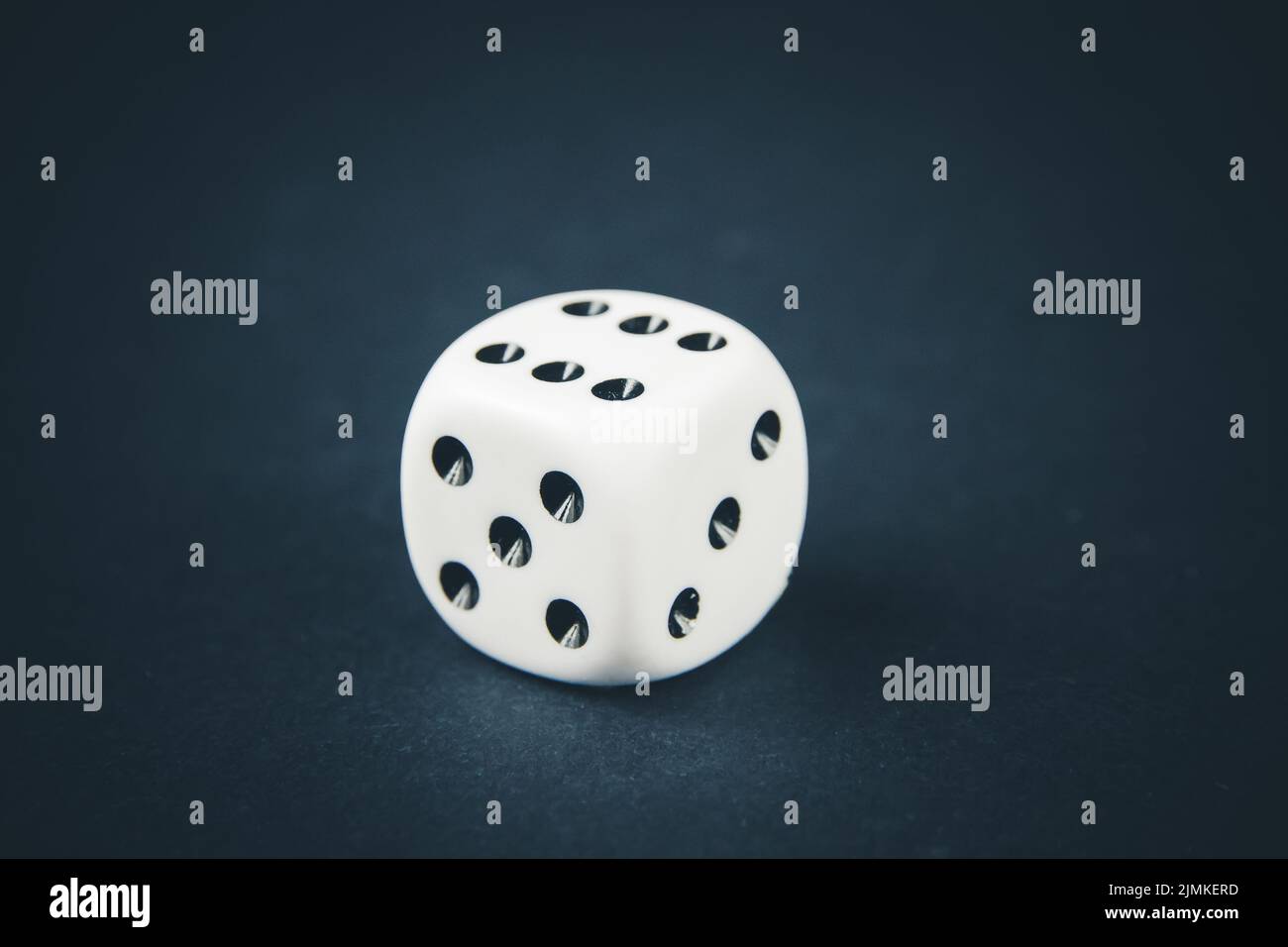 White dice on black table background Stock Photo