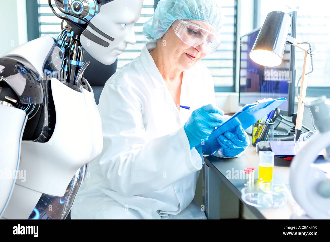 Scientist and humanoid robot work together Stock Photo
