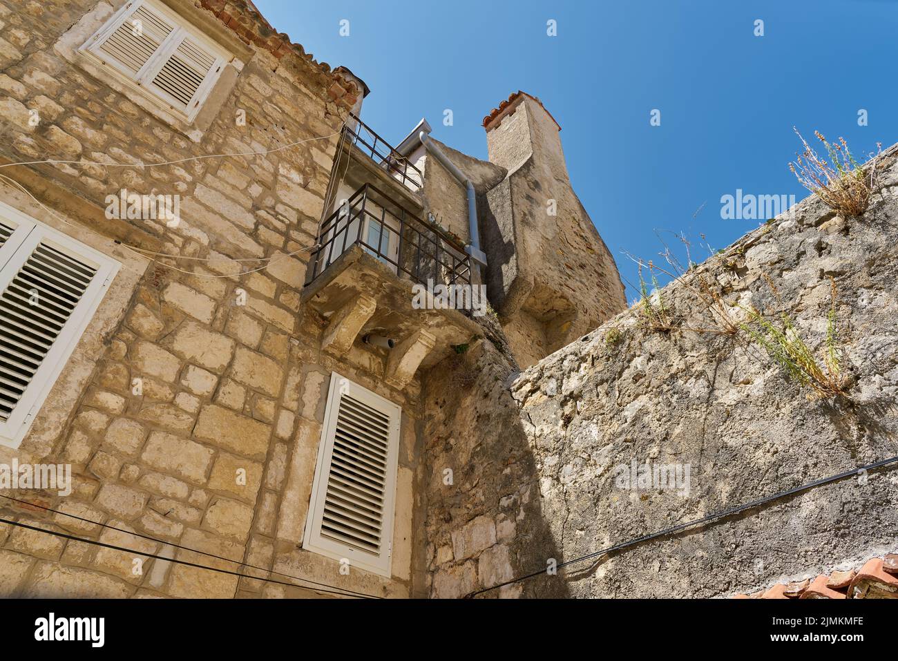 Historical for the region typical house in an alley in the old town of Rab in Croatia Stock Photo