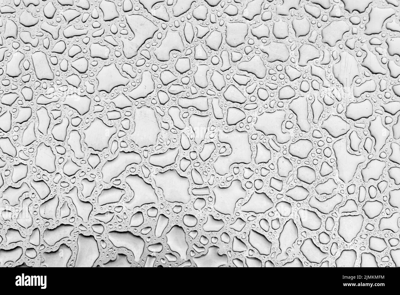 Water drops on stainless steel metal plate after rain Stock Photo