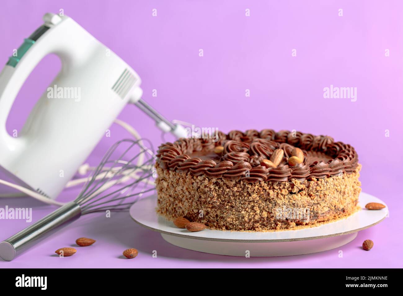 Almond cake with butter chocolate cream. Stock Photo