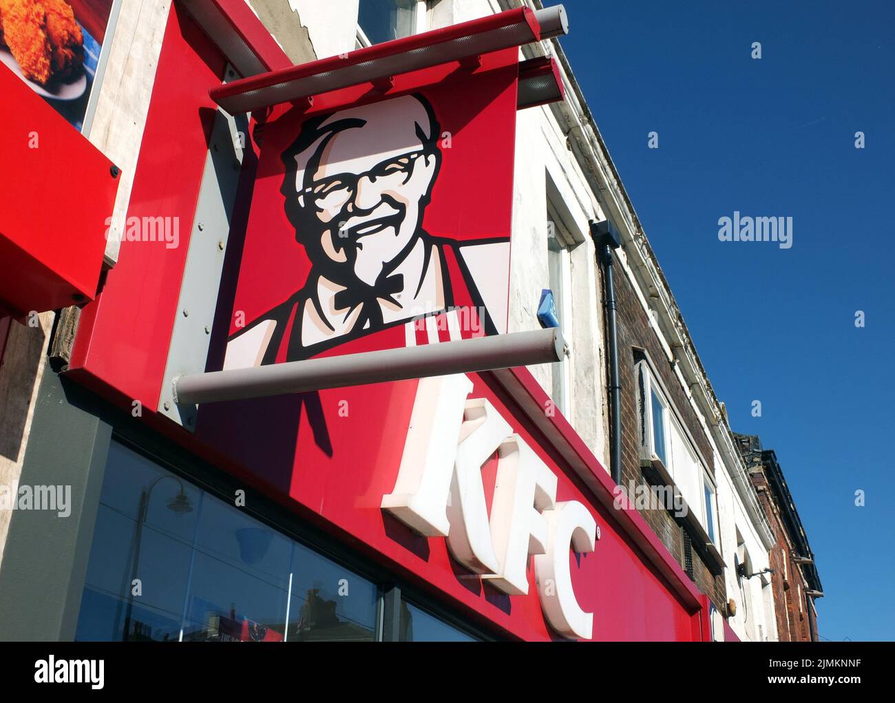 Kfc sign and logo above a high street restaurant and takeaway in Fleetwood Stock Photo