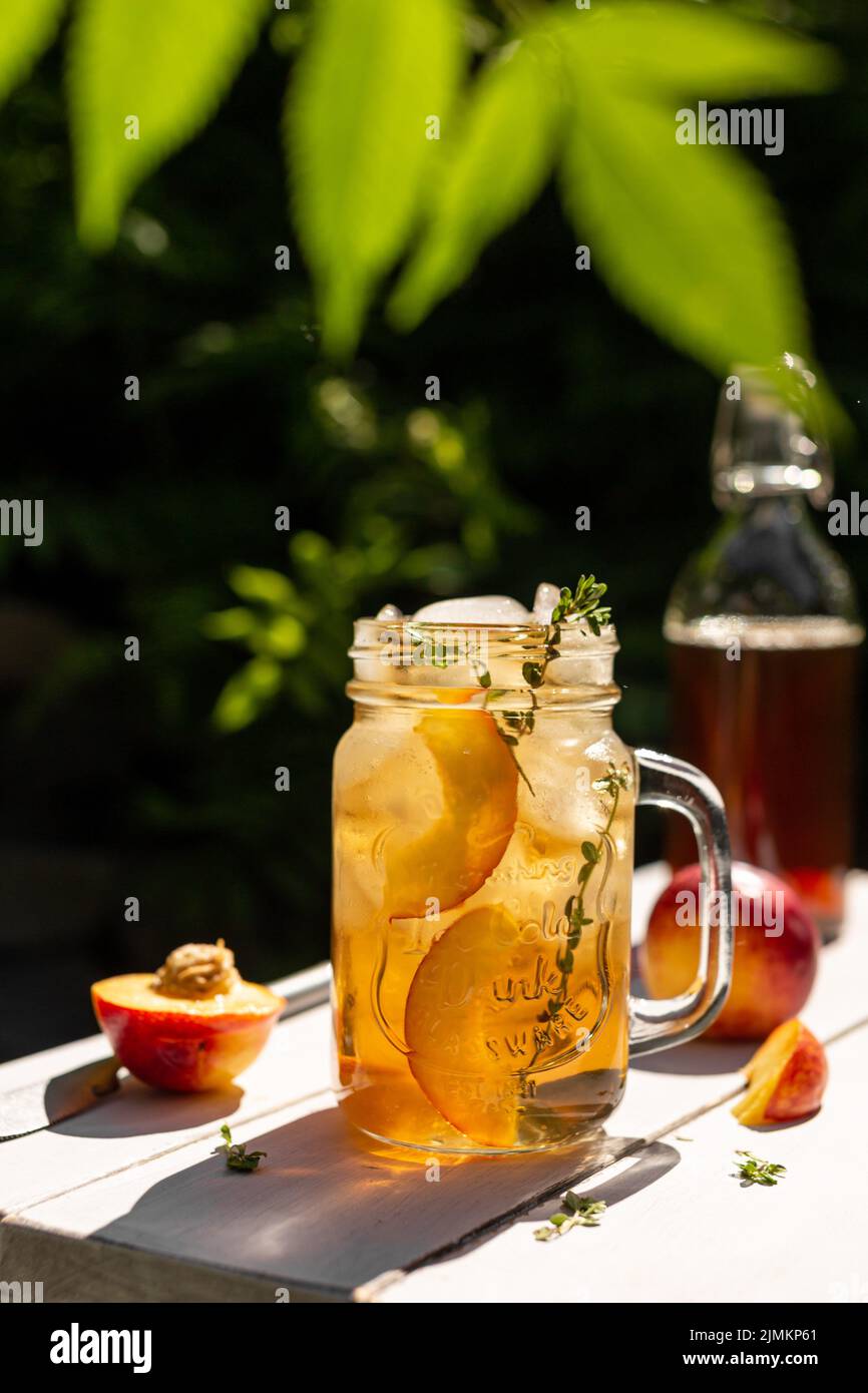 Iced tea with peaches in a glass Stock Photo Alamy