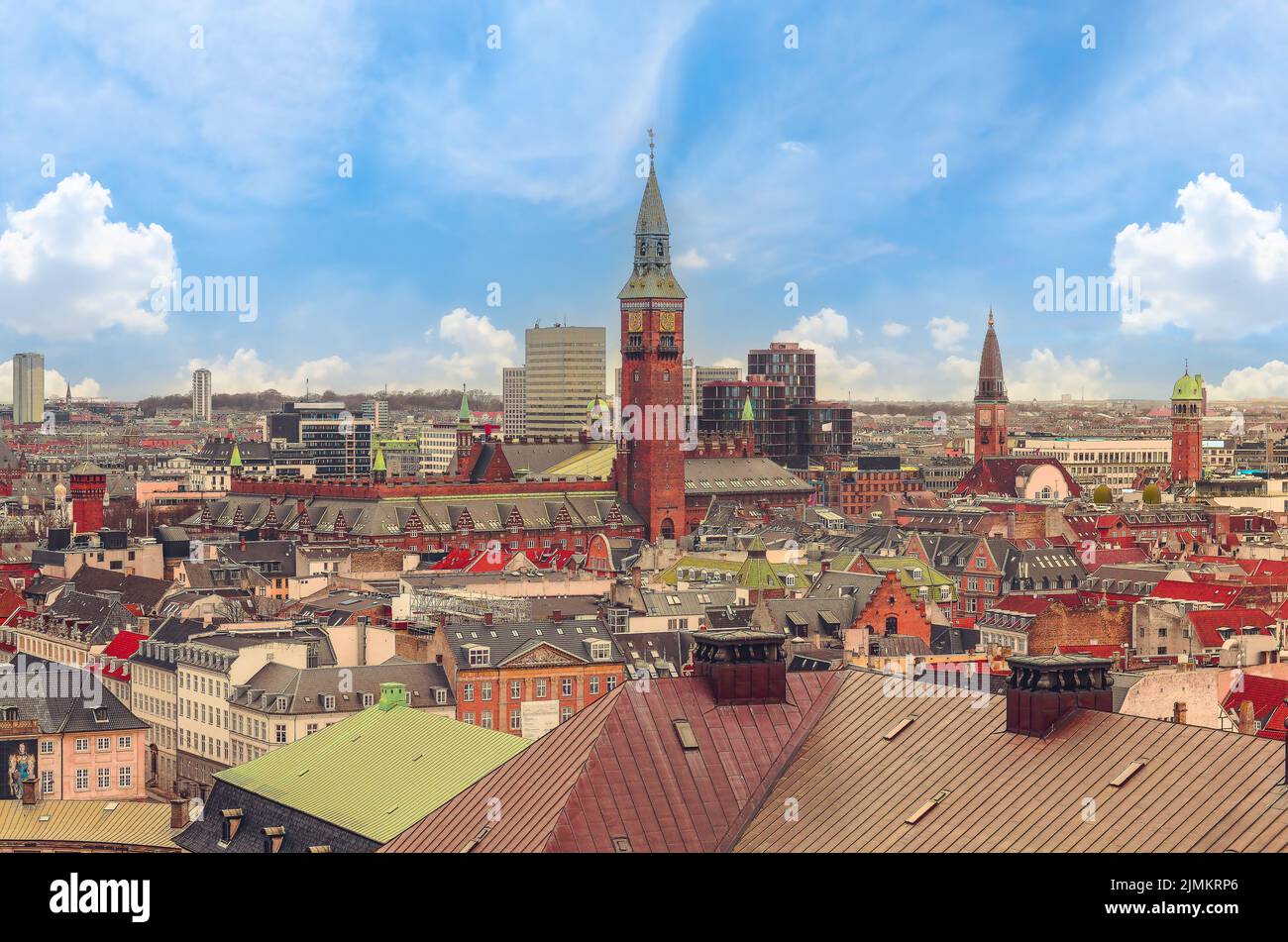 Panoramic view of the roofs of buildings in the central part of the old city and tower of Copenhagen City Hall. Copenhagen, Denm Stock Photo