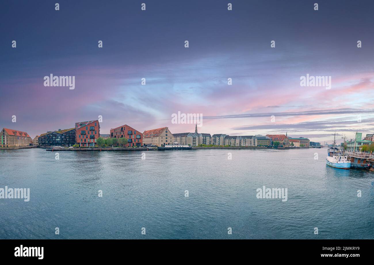 View on small buildings of Christianshavn neighbourhood and water of Copenhagen canal. Copenhagen, Denmark Stock Photo