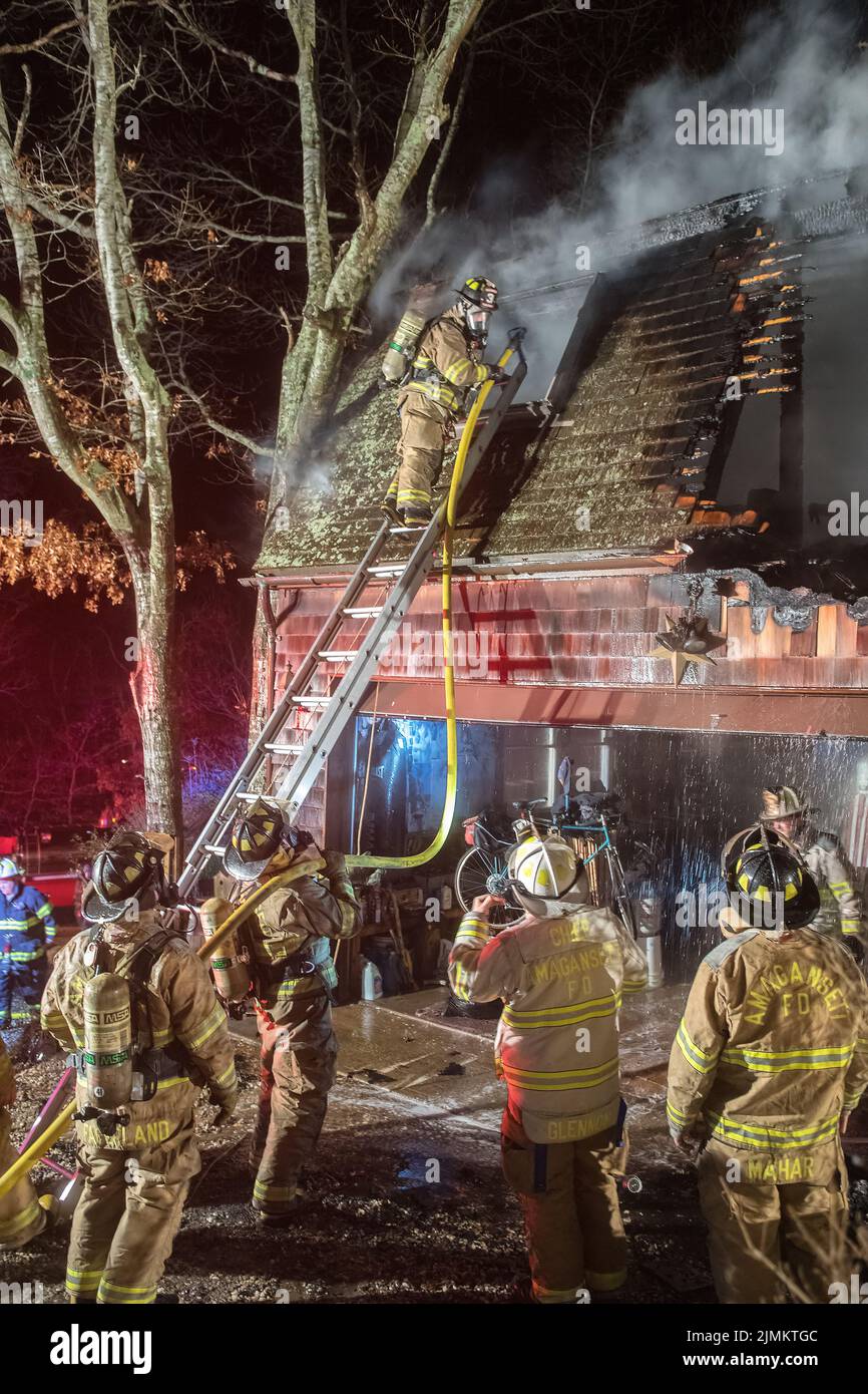 Amagansett Fire Department firefighters fight a working fire in a