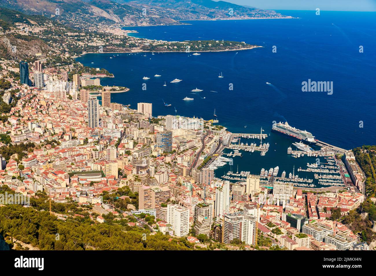 Aerial view of port Hercules of Monaco at sunset, Monte-Carlo, huge cruise ship is moored in marina, view of city life from La T Stock Photo