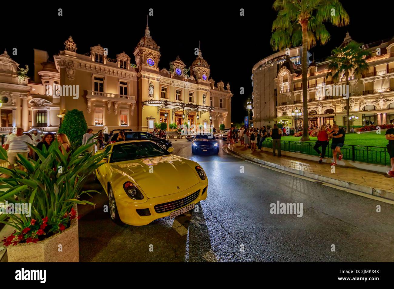 Monaco, Monte Carlo, 21 August 2019: Luxury sport car Ferrari near the hotel Paris and casino in night, lights of the place Casi Stock Photo