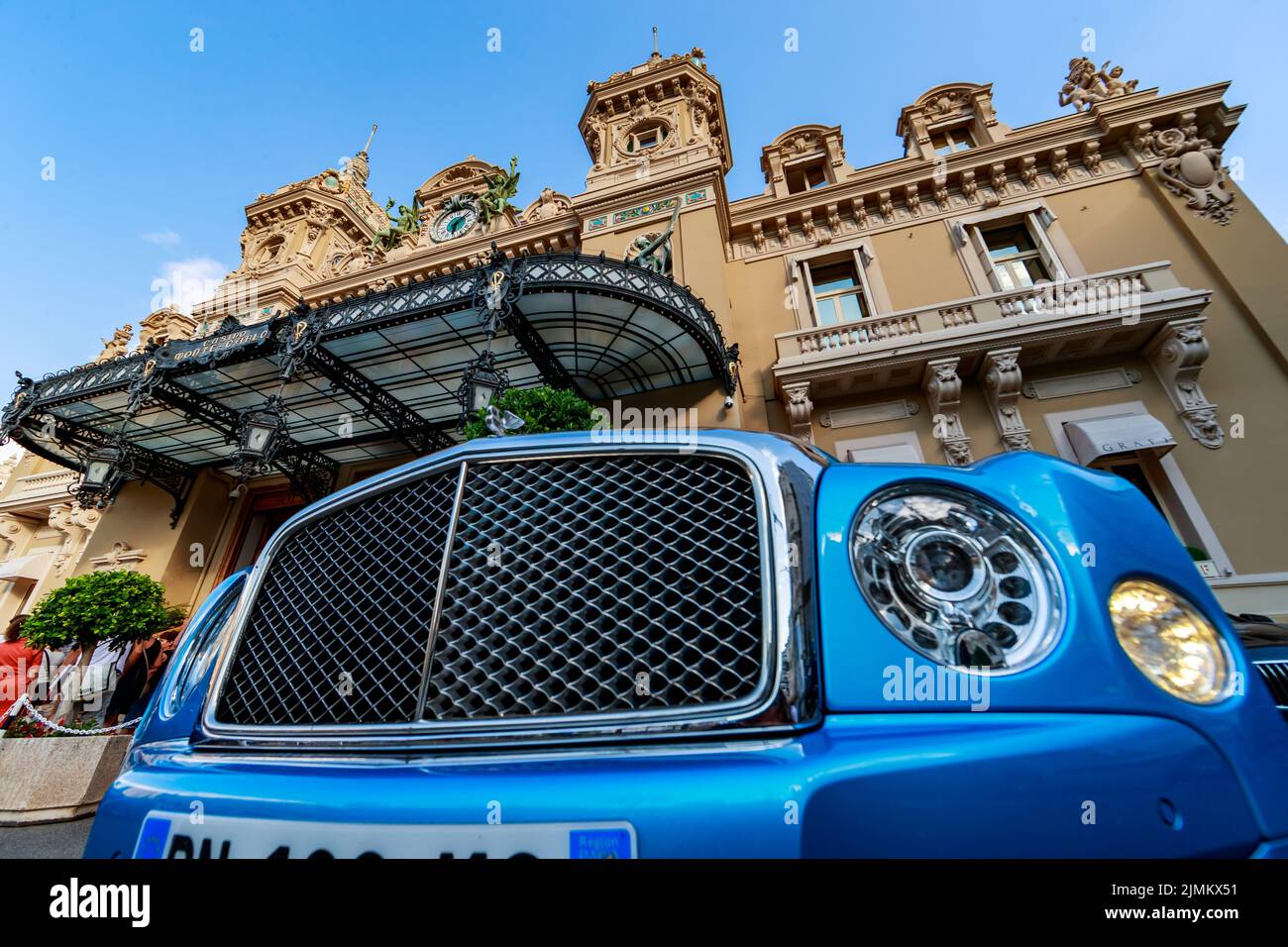 Monaco, Monte-Carlo, 21 August 2017: Luxury car Bentley of blue color near casino Monte-Carlo at sunset, view from Hotel de Pari Stock Photo