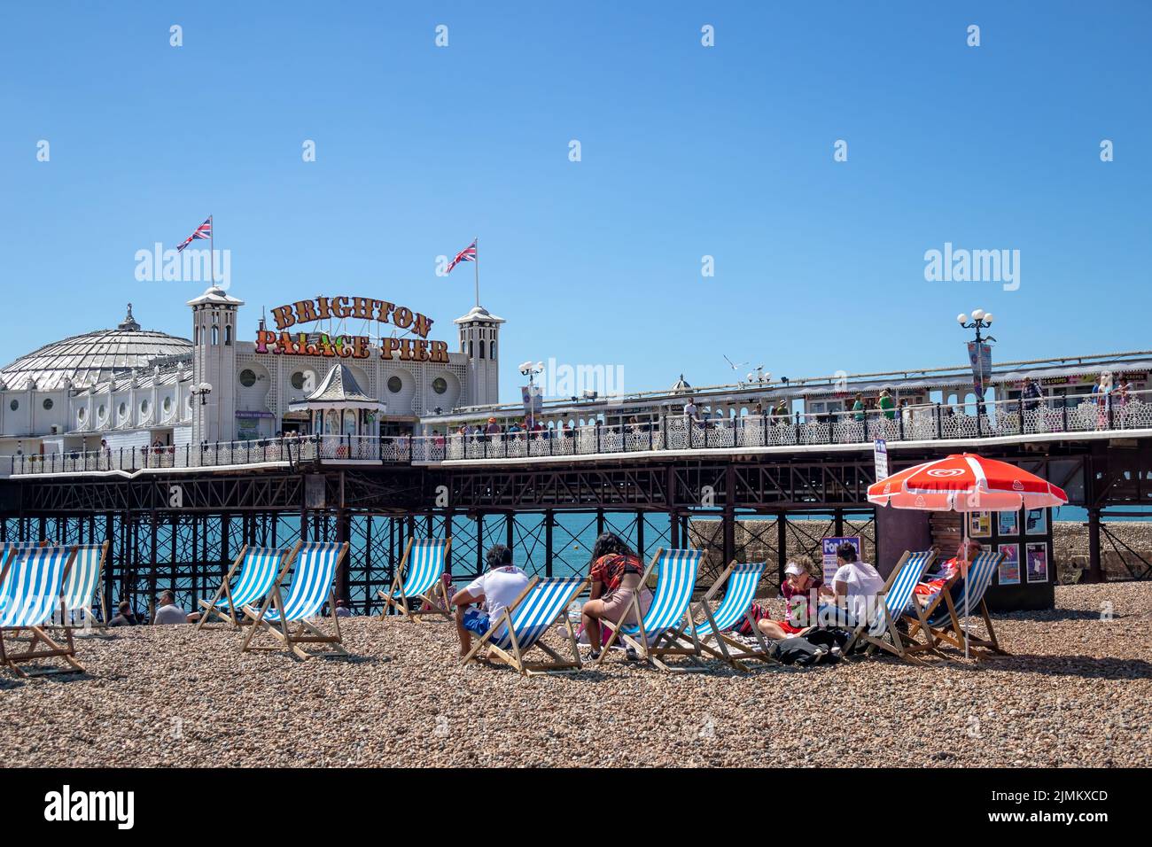 Brighton, East Sussex, UK - AUGUST 5, 2022 : View of the pier in Brighton on August 5, 2022. Unidentified people Stock Photo