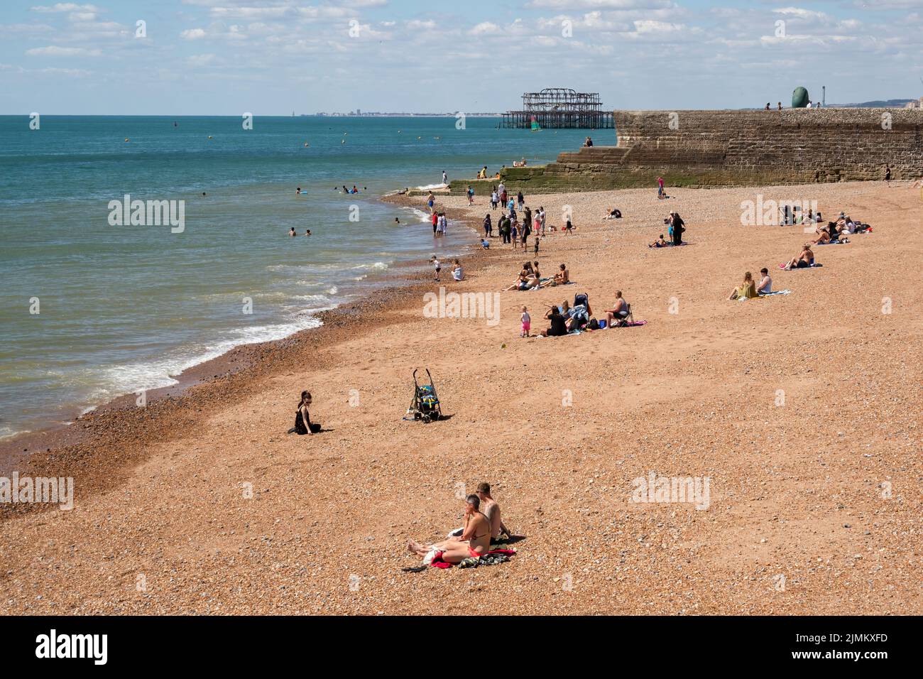 Brighton, East Sussex, UK - August 5 2022 : View of the beach in Brighton on August 5, 2022. Unidentified people Stock Photo