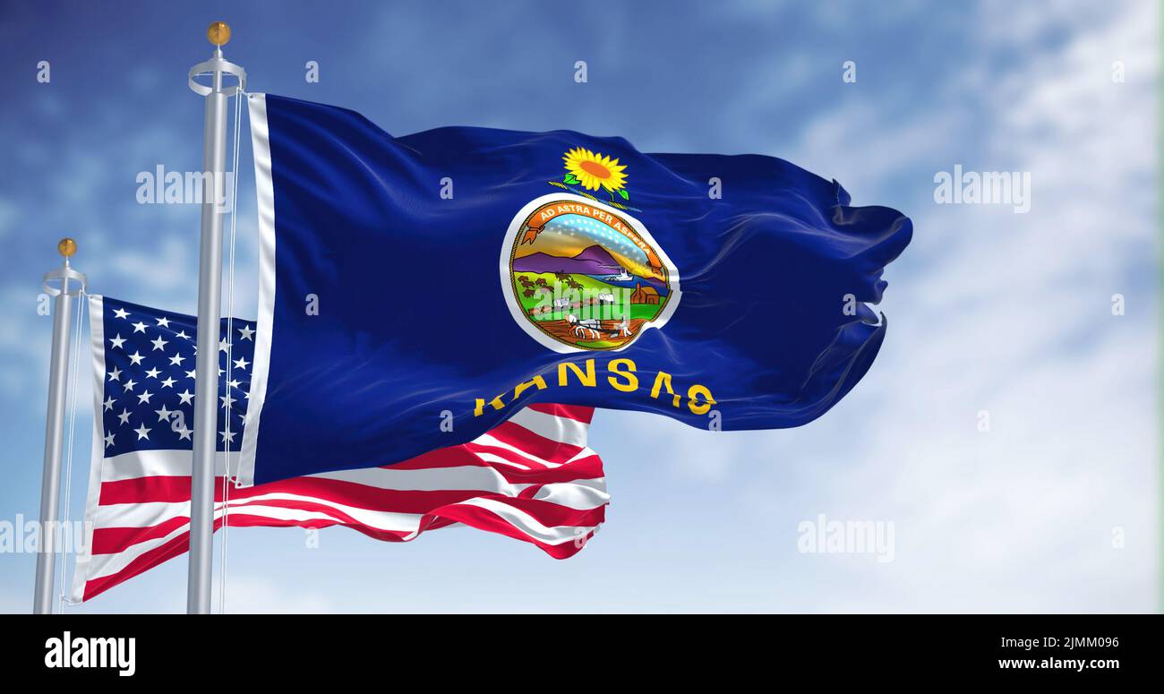 The Kansas state flag waving along with the national flag of the United