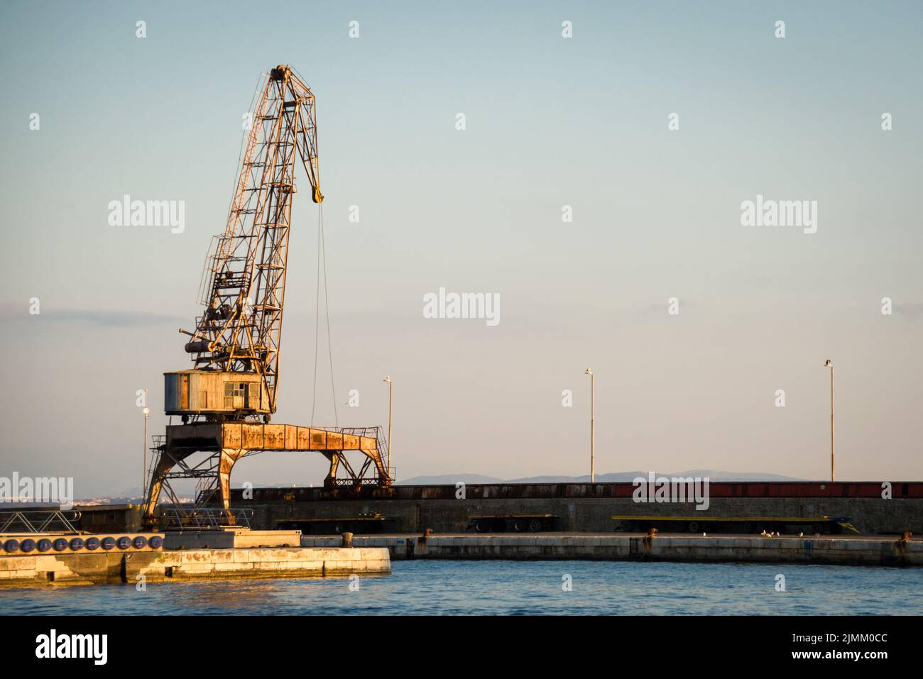 Cranes in the ship's port as silhouettes, in Rijeka in Croatia Stock Photo