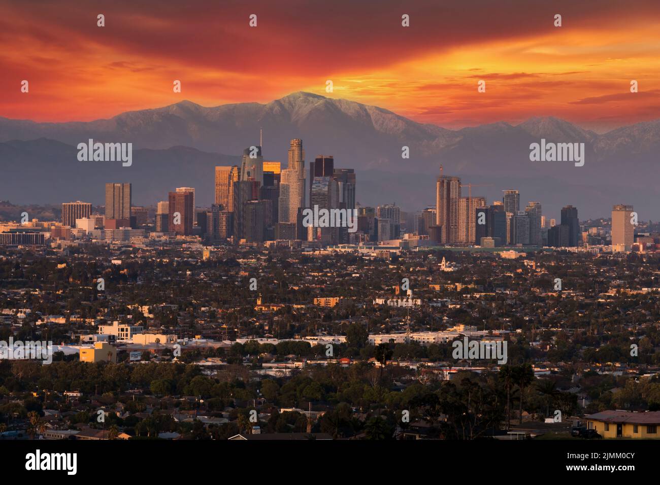 The Los Angeles Skyline At Dusk Against The San Gabriel Mountains Stock