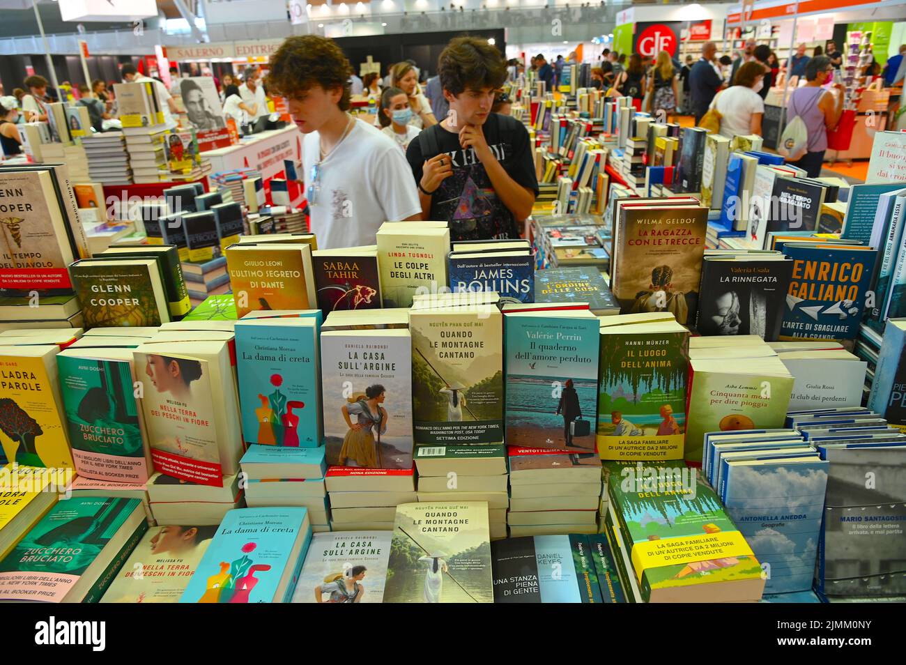 Several people seeking for books at international book fair in Turin, Italy Stock Photo