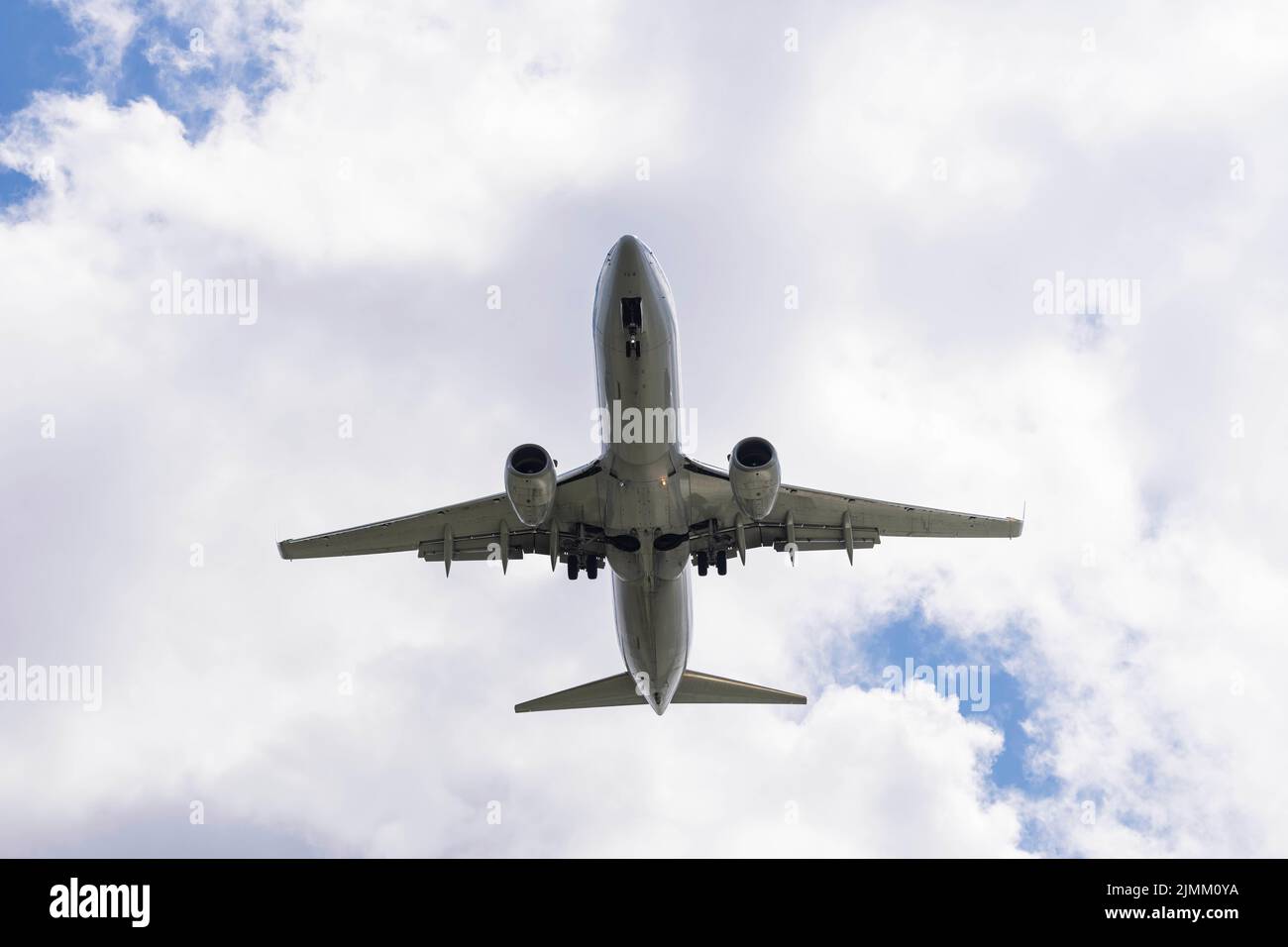 Commericial Aircraft Landing At An Internatioal Aiport During The Day Stock Photo