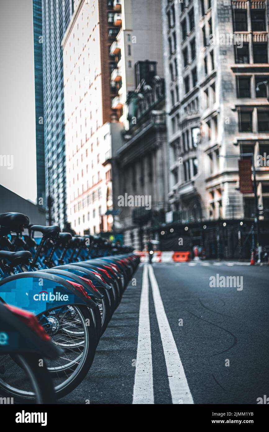 A vertical shot of a Citibike station in the financial district Stock Photo