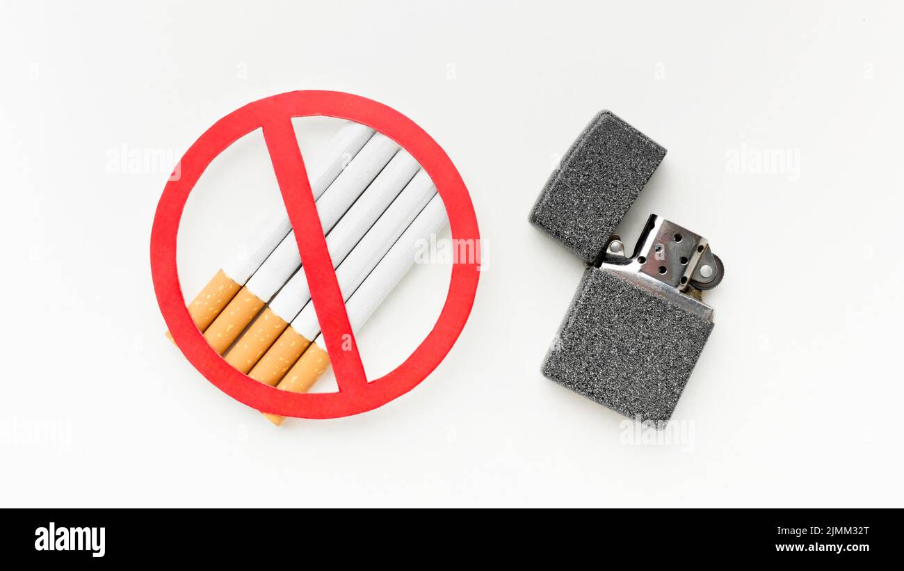Cigarettes with lighter message stop habit Stock Photo